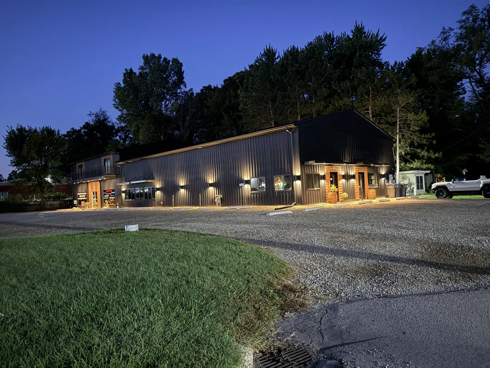Corrective Chiropractic building exterior lit up at dusk